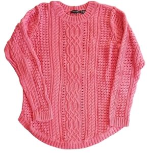 Jeanne Pierre Coral colored cable knit sweater.